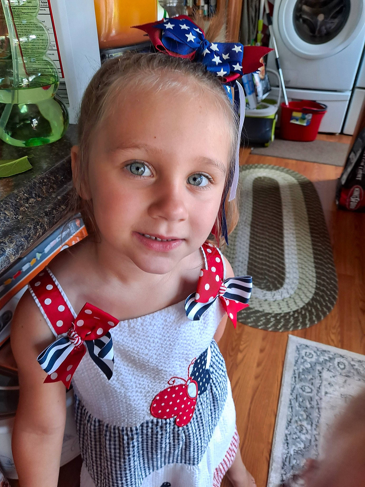 Jocelynn is registered to the contest to win money with this photo: audio_equipment, automotive_tire, baby_toddler_clothing, cheek, child, chin, clothes_dryer, eye, fun, hair, happy, headgear, joy, neck, pattern, person, red, skin, standing, tire