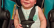Ronnie is registered to the contest to win money with this photo: baby, car_seat, child, clothing, cute, face, hand, happy, harness, head, infant, legs, portrait, safety, seat, secure, sitting, skin, smile, striped_outfit