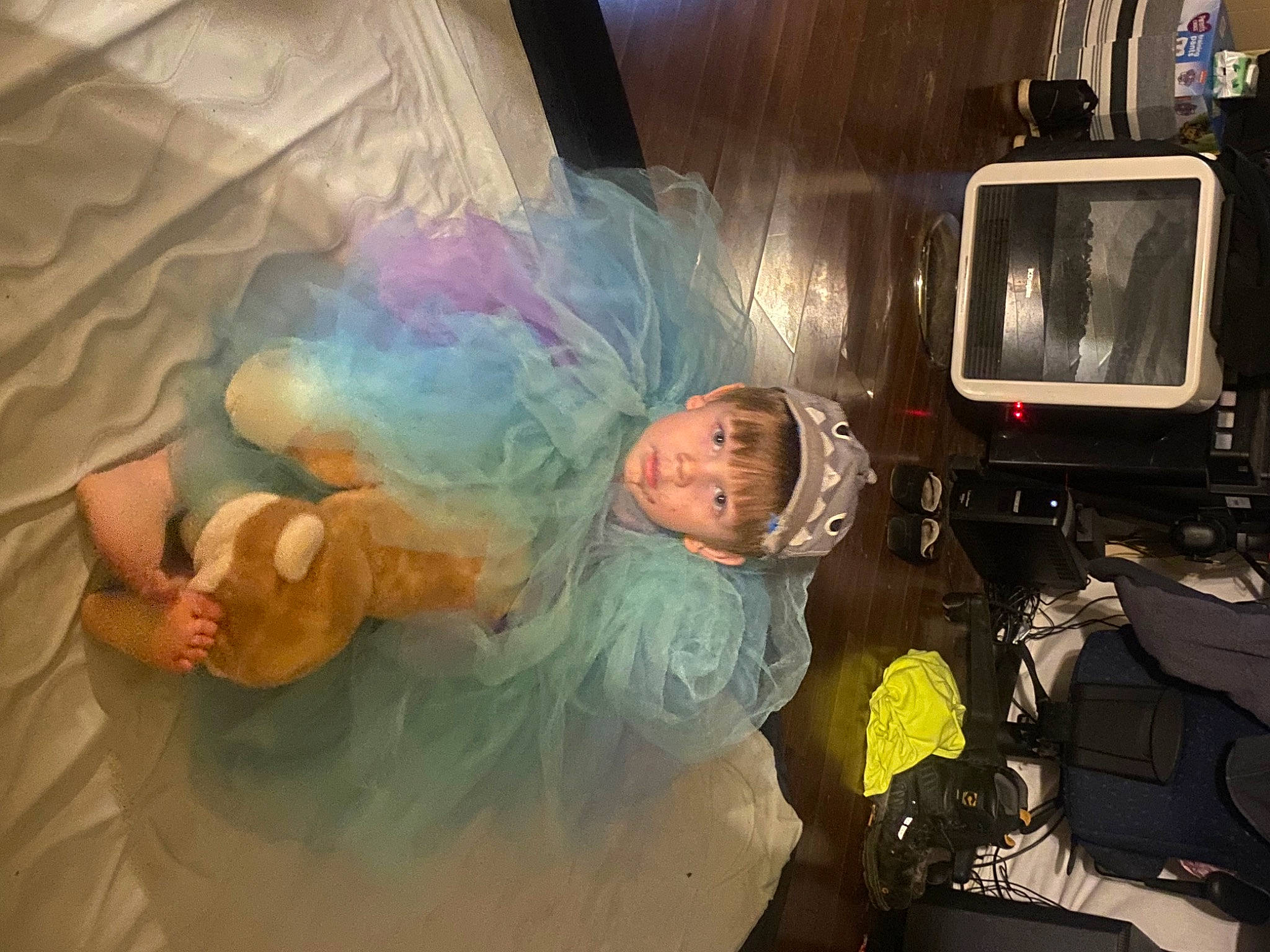 Samuel Henry is registered to the contest to win money with this photo: astronaut, bathing, ceiling, child, display_device, fun, gadget, gesture, glass, happy, leisure, machine, person, personal_protective_equipment, recreation, room, space, television, television_set, visual_arts