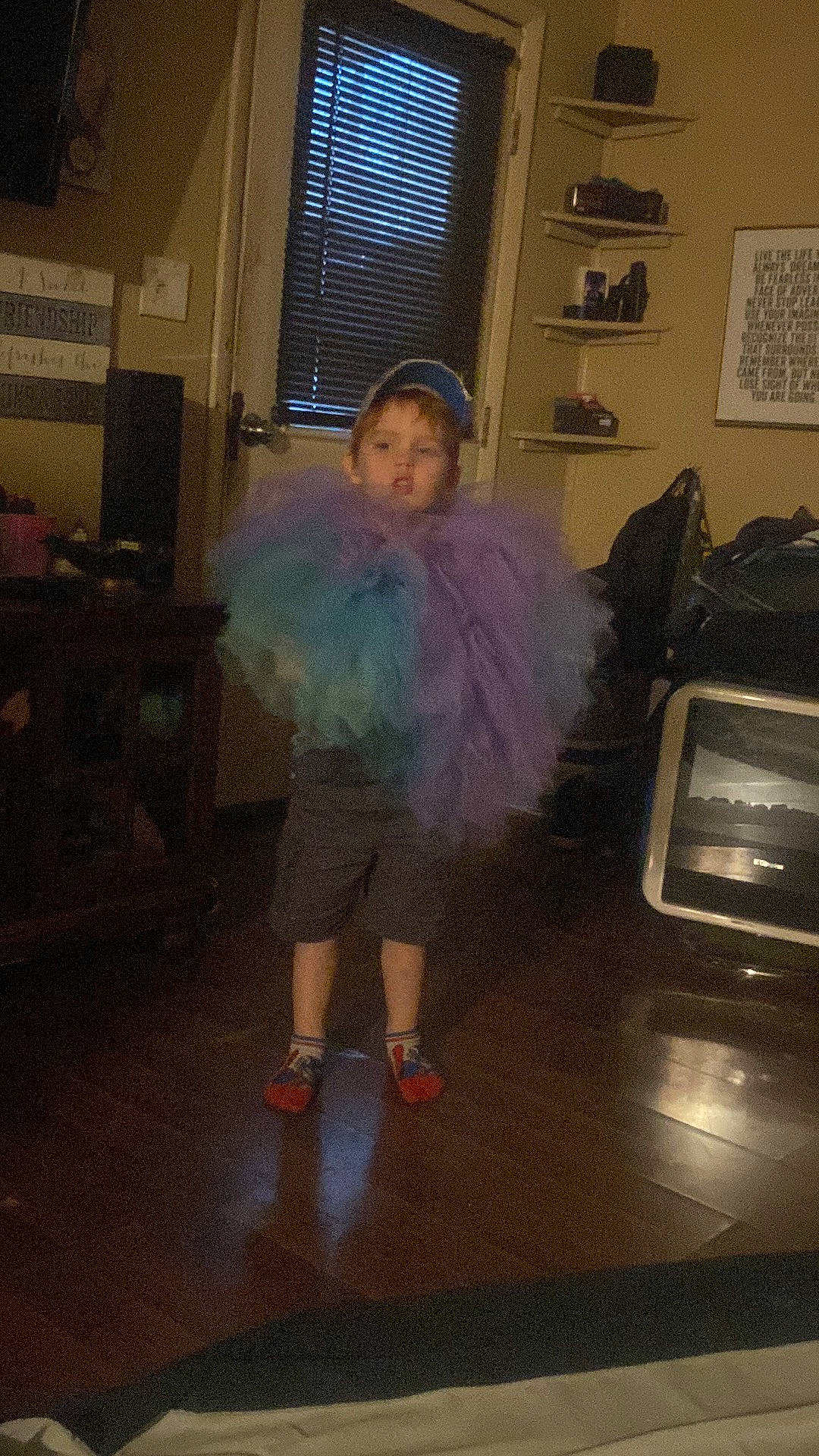 Gabriel King joined the competition — help win amazing prizes! child, costume, event, fashion_accessory, fashion_design, feather, floor, flooring, fun, fur, fur_clothing, magenta, person, picture_frame, room, television_set, toddler, window, window_blind