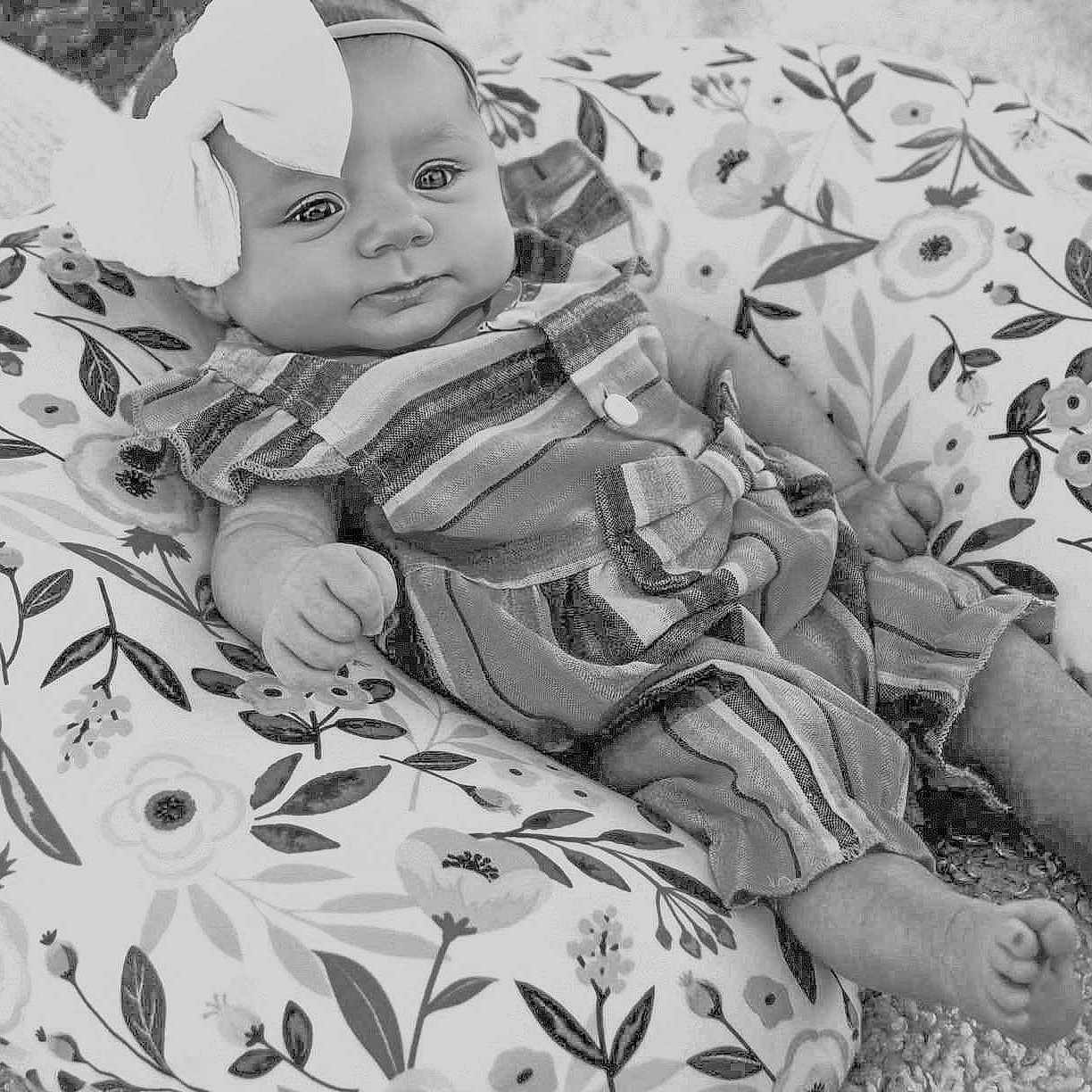 Paislee is registered to the contest to win money with this photo: baby, beanbag, blanket, bodypart, cap, clothing, couch, cushion, face, furniture, happy, hat, head, homedecor, newborn, person, photography, portrait, sleeping, smile
