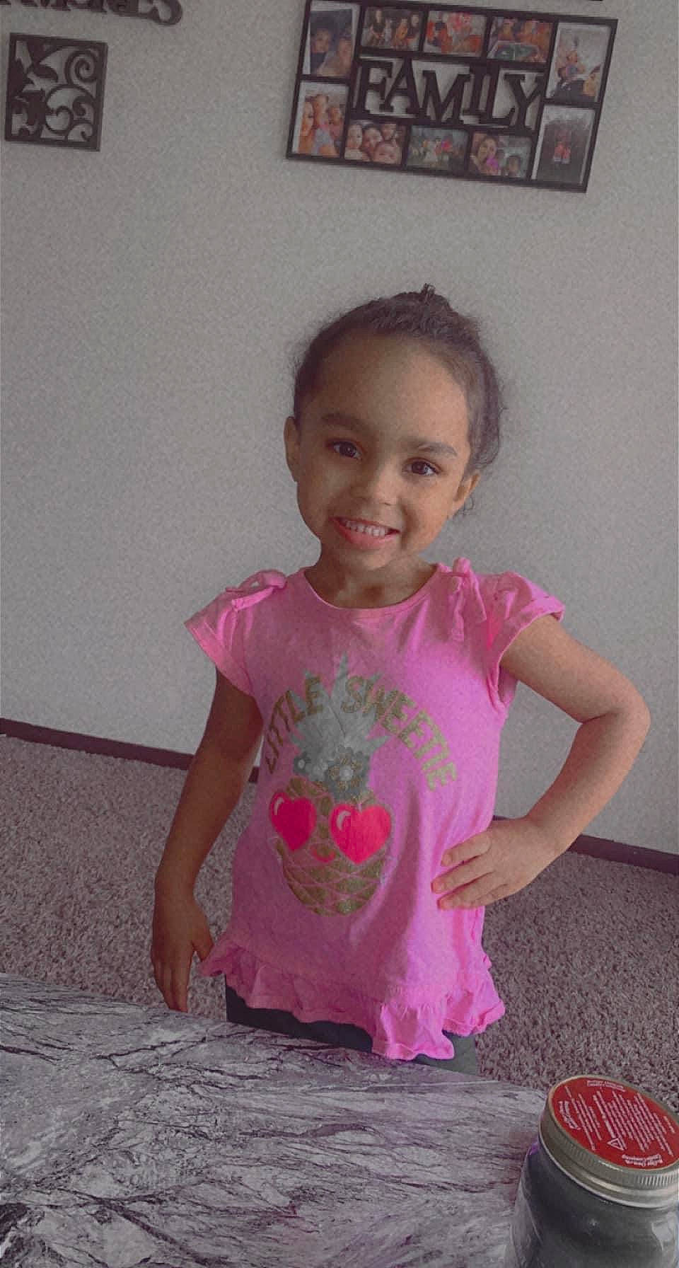 Jazzlynn is registered to the contest to win money with this photo: baby_toddler_clothing, cheek, child, finger, floor, flooring, fun, happy, joy, magenta, pattern, person, picture_frame, pink, purple, room, sitting, skin, sleeve, smile