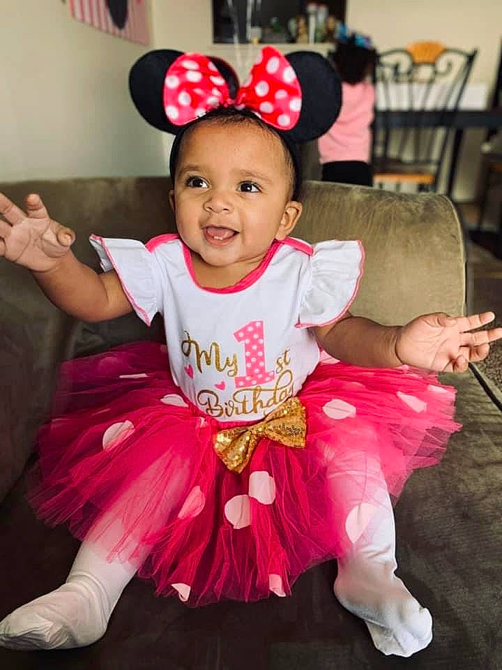 Kahlia joined the competition — help win amazing prizes! baby, baby_toddler_clothing, ballet_tutu, chair, child, costume, event, fashion_accessory, fun, happy, magenta, mammal, party, person, pink, purple, ruffle, sleeve, smile, textile