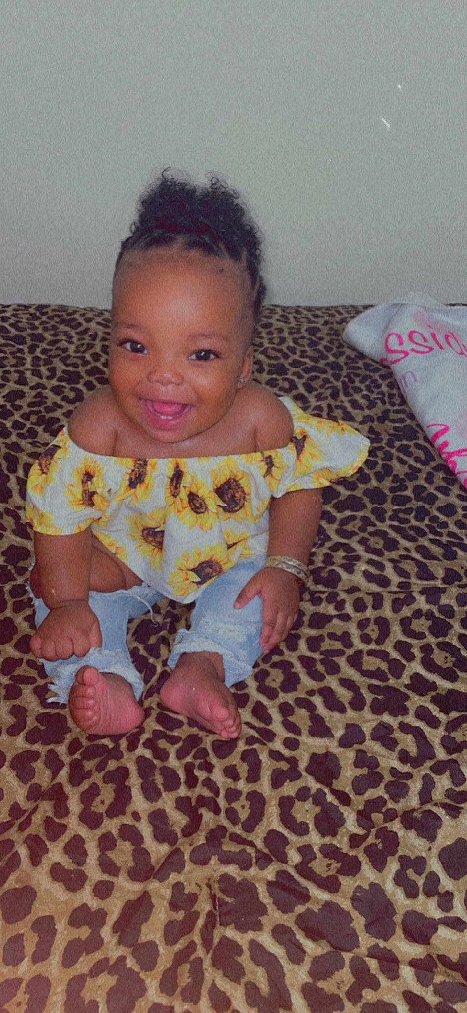 Cassidy is registered to the contest to win money with this photo: arm, baby, baby_toddler_clothing, cheek, dress, eye, face, finger, floor, hand, head, human_body, iris, joy, mouth, nose, person, pink, skin, sleeve