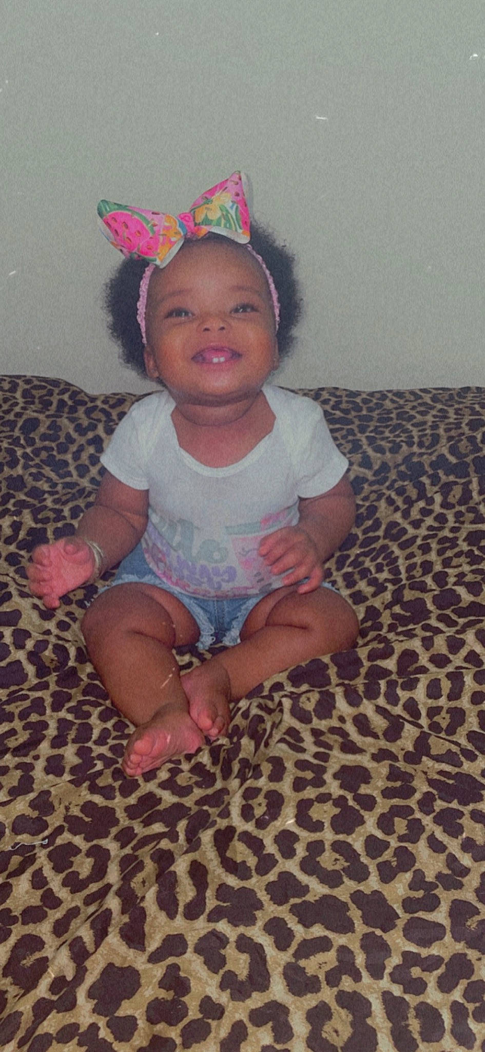 Cassidy is registered to the contest to win money with this photo: baby, baby_toddler_clothing, cheek, child, comfort, costume_hat, eye, face, flooring, foot, fun, happy, hat, human_body, iris, party_hat, party_supply, person, pink, skin