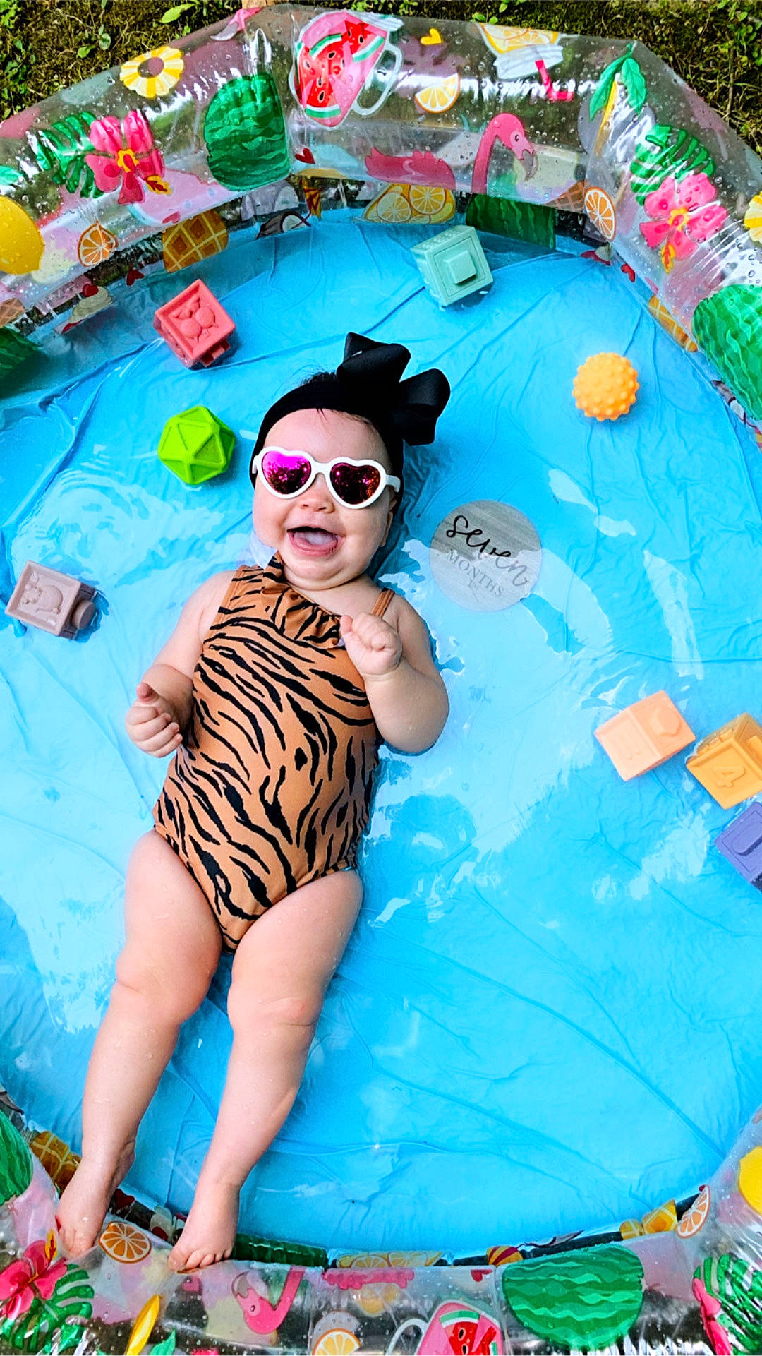 Dahlia is registered to the contest to win money with this photo: aqua, blue, child, electric_blue, eyewear, fun, goggles, happy, hat, leisure, person, photograph, recreation, smile, summer, sunglasses, swimwear, thigh, toddler, travel