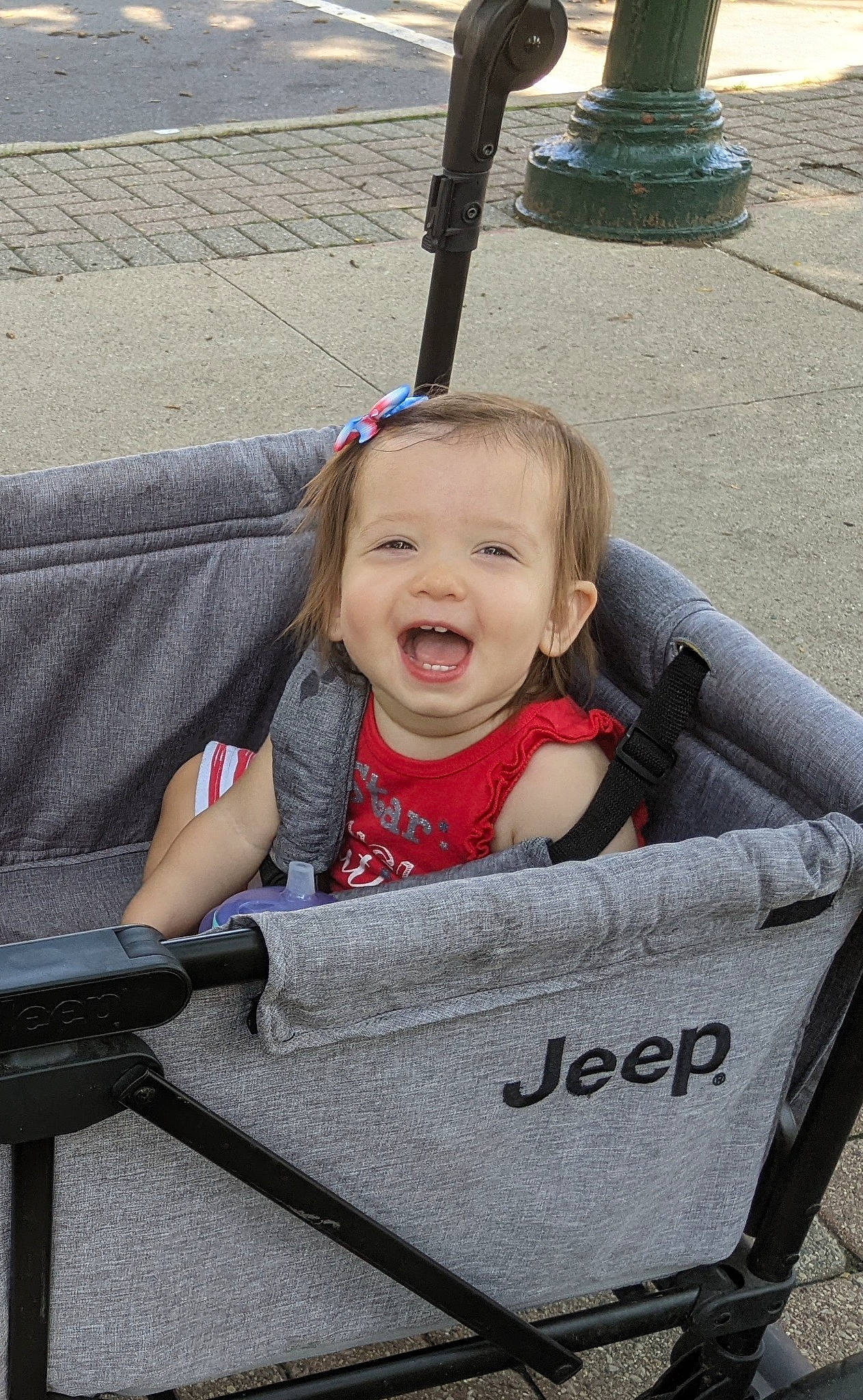 Kora is registered to the contest to win money with this photo: auto_part, automotive_tire, automotive_wheel_system, baby, baby_carriage, baby_products, beauty, child, comfort, face, grass, happy, leisure, person, product, sitting, smile, tire, toddler, travel