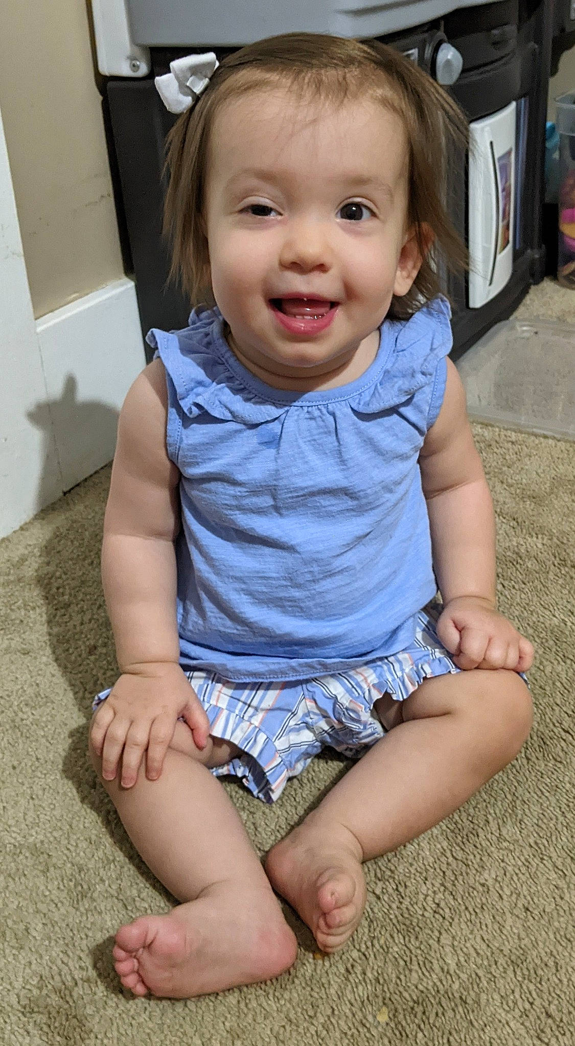 Kora is registered to the contest to win money with this photo: arm, baby_toddler_clothing, cheek, child, chin, eye, face, finger, hair, happy, head, human_leg, iris, joint, joy, organ, person, skin, sleeve, smile