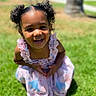 Blossom is registered to the contest to win money with this photo: child, girl, smile, outdoor, grass, dress, curly_hair, pigtails, sunlight, happy, portrait, nature, greenery, cute, young, person, daylight, fashion, childhood, playful