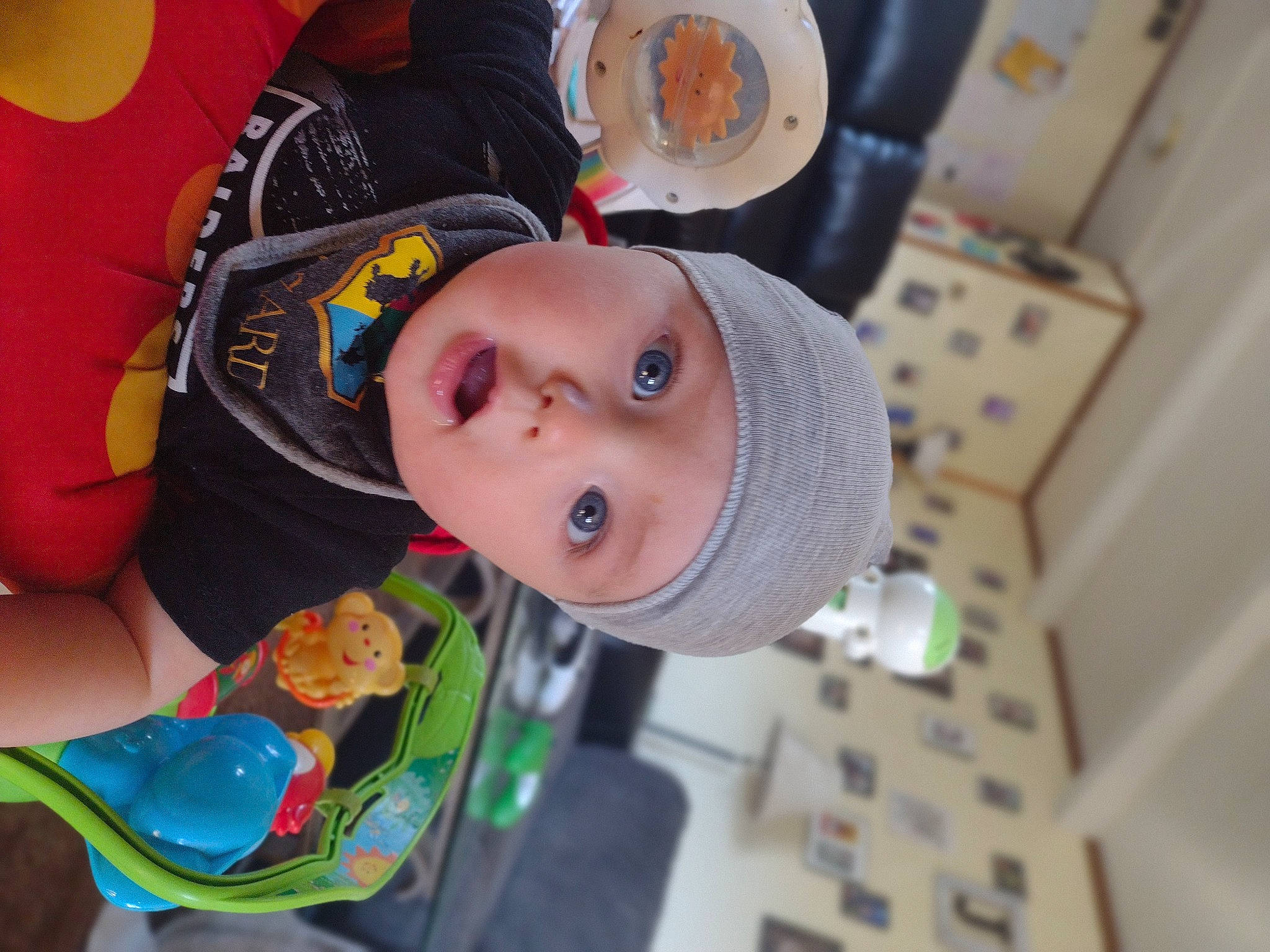 Jordin is registered to the contest to win money with this photo: baby, baby_products, baby_toys, cap, child, fashion_accessory, fun, hat, headwear, person, personal_protective_equipment, plastic, plastic_bottle, play, room, surprise, tableware, toddler, toy, water_bottle