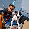 Snowman joined the competition — help win amazing prizes! bed, bedroom, birthday, black_and_white_dog, blanket, blue_wall, boy, celebration, child, companion, dog, home, indoors, party_hat, pet, photography, portrait, seated, short_hair, smiling