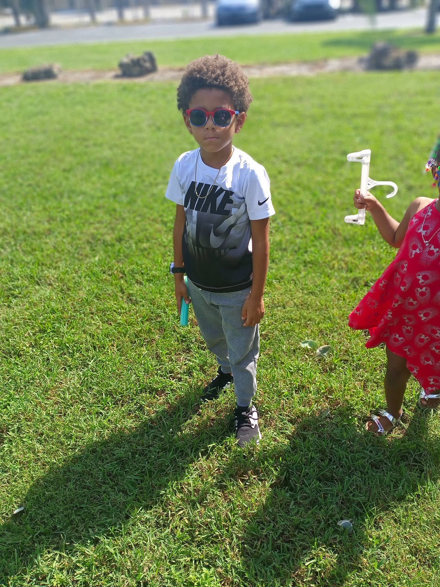 Junior joined the competition — help win amazing prizes! eyewear, fun, gesture, goggles, grass, grass_family, grassland, groundcover, happy, lawn, leisure, mammal, meadow, people_in_nature, person, plant, recreation, shoe, sunglasses, toddler