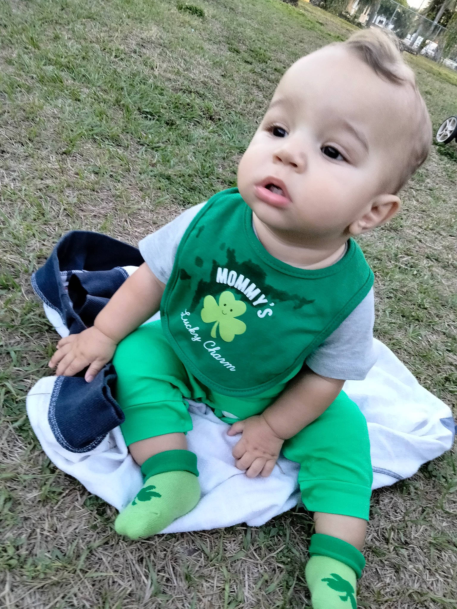 Jasper Giovanni is registered to the contest to win money with this photo: baby, baby_toddler_clothing, child, electric_blue, fun, grass, grass_family, knee, lawn, leisure, people_in_nature, person, plant, recreation, sitting, sleeve, sock, soil, t_shirt, thigh