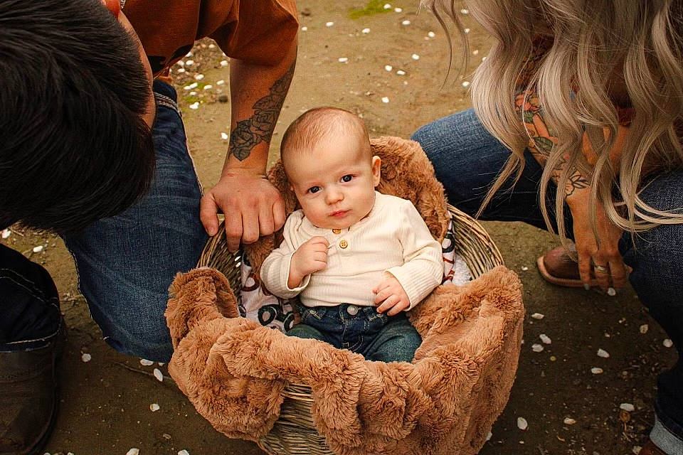 Lennox joined the competition — help win amazing prizes! baby, boot, child, event, family, flash_photography, flooring, fun, fur, grass, happy, human_body, interaction, lap, person, sitting, skin, toddler, tree, wood