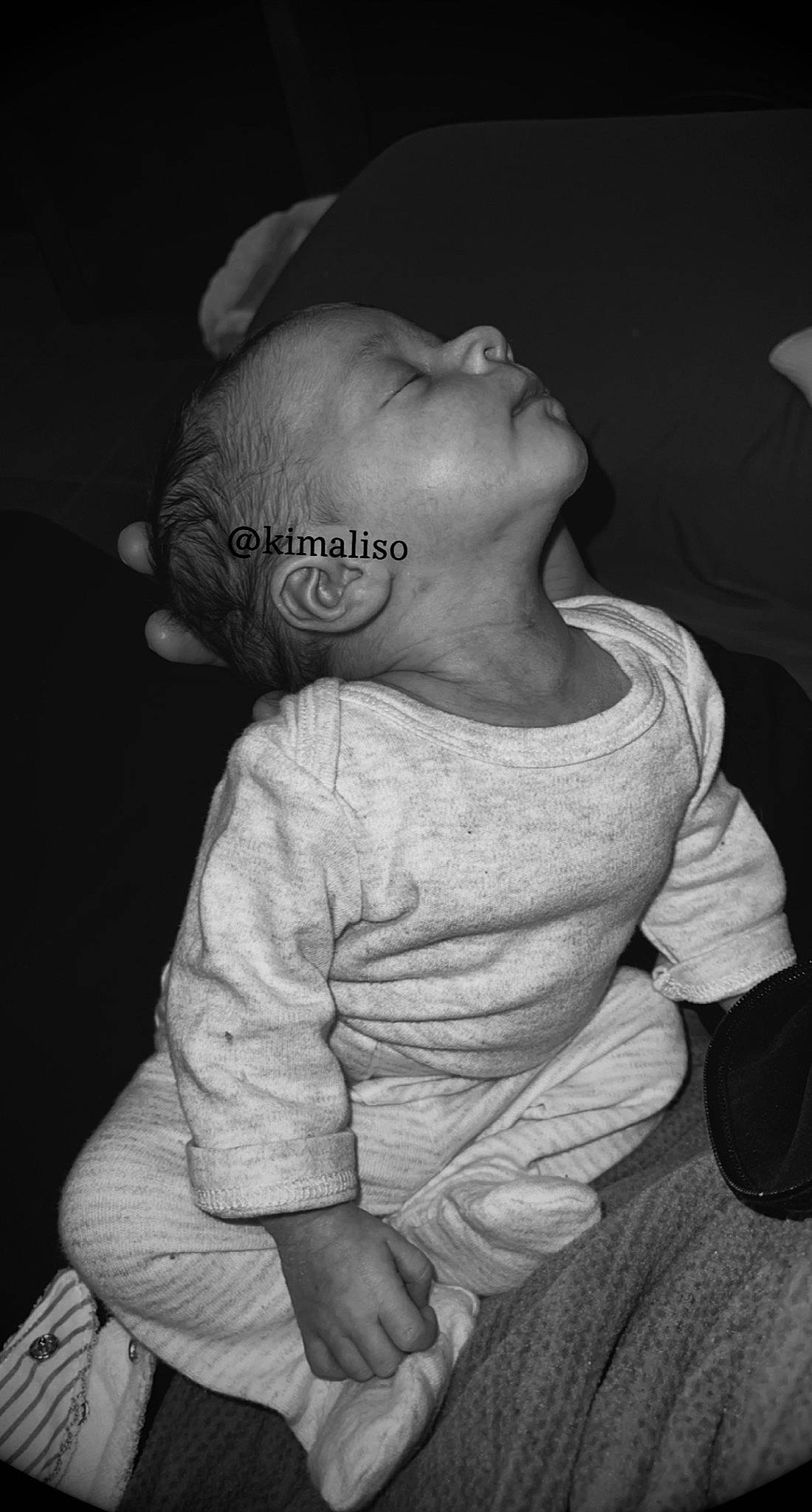 Aliya participe au concours pour gagner de l'argent avec cette photo : arm, baby, baby_toddler_clothing, black, cheek, ear, eye, flash_photography, gesture, grey, hand, head, human_body, mouth, neck, nose, outerwear, person, skin, sleeve