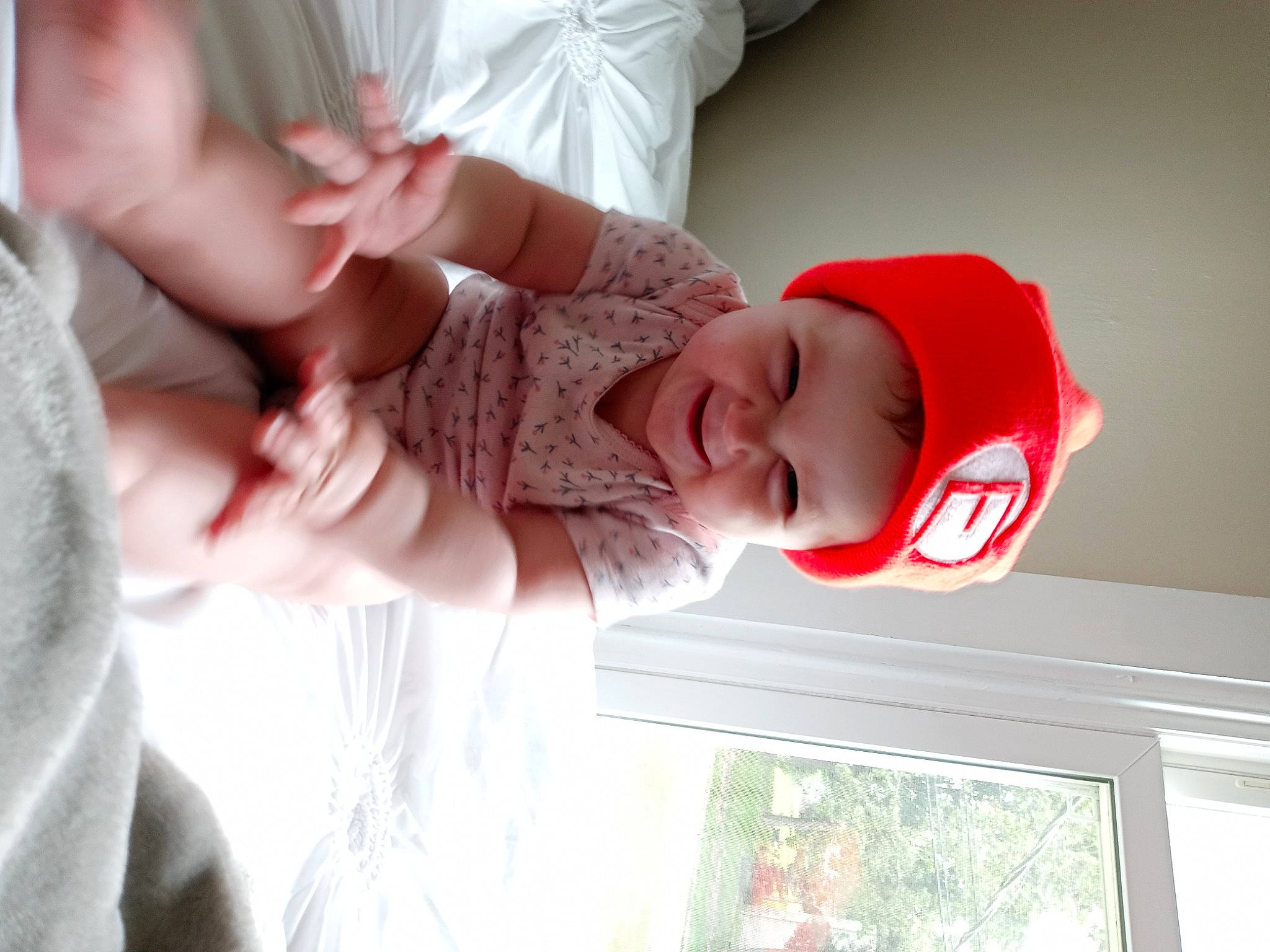 Quinn joined the competition — help win amazing prizes! baby, baby_toddler_clothing, child, comfort, finger, fun, gesture, hand, happy, hat, headwear, human_body, nose, person, pink, plant, skin, sleeve, smile, toddler