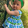 Sailey participe au concours pour gagner de l'argent avec cette photo : toddler, child, girl, dress, headband, green_bow, flower_pattern, outdoor, grass, fence, sky, sunny, curious, smile, portrait, young_child, nature, daylight, playful, baby
