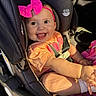 Emery joined the competition — help win amazing prizes! baby, child, car_seat, pink_bow, headband, smiling, happy, sunlight, seat_belt, orange_shirt, infant, cute, portrait, sitting, interior, car, clothing, skin, small_child, daylight