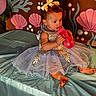 Emery joined the competition — help win amazing prizes! baby, bottle, bow, celebration, child, curly_hair, cute, decorations, dress, face, indoor, party, pink, portrait, seaweed, shells, sitting, table_cover, toddler, underwater_theme