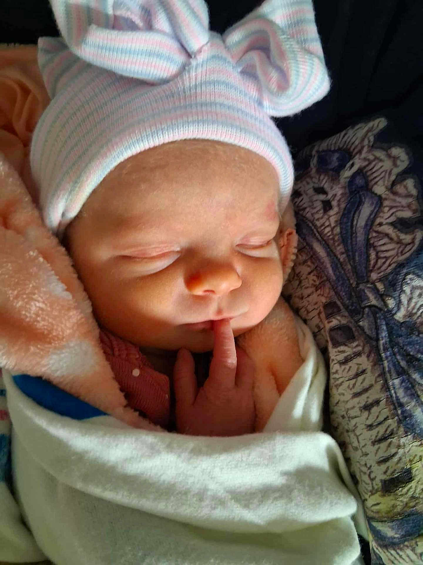 Lilly is registered to the contest to win money with this photo: newborn, baby, sleeping, infant, hat, blanket, wrapped, finger, cute, soft, peaceful, closeup, child, portrait, resting, cozy, face, headwear, warm, indoors