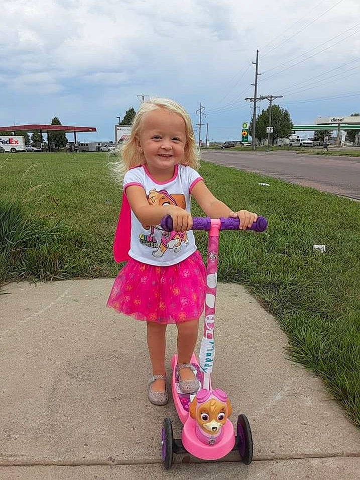 Maddie joined the competition — help win amazing prizes! cloud, dress, fun, grass, happy, joy, kick_scooter, people, person, pink, plant, public_space, riding_toy, sky, smile, summer, tire, toddler, toy, tree