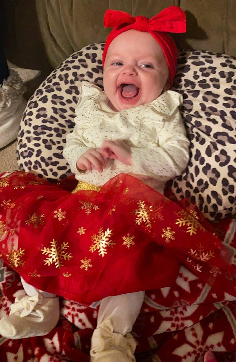 Jaliyah joined the competition — help win amazing prizes! baby, baby_laughing, baby_toddler_clothing, cheek, child, christmas, comfort, event, face, happy, headwear, holiday, human_body, lap, linens, pattern, person, red, sleeve, smile