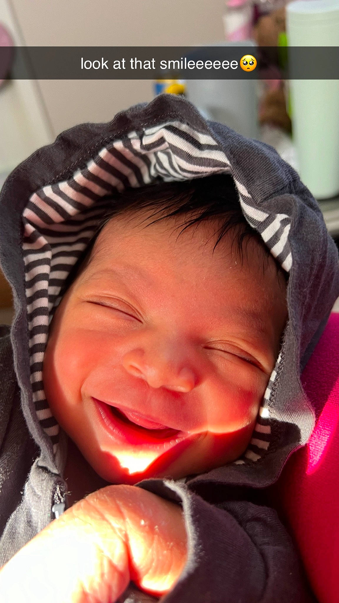 Amila is registered to the contest to win money with this photo: baby, cap, cheek, cool, eyebrow, face, finger, happy, head, jaw, lip, mouth, nose, person, photograph, pink, plant, skin, smile, snapshot