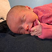 Anlee is registered to the contest to win money with this photo: baby, newborn, sleeping, infant, pink_clothing, polka_dot, hand, face, closed_eyes, skin, resting, peaceful, cute, person, portrait, soft_lighting, indoor, cozy, closeup, sleep