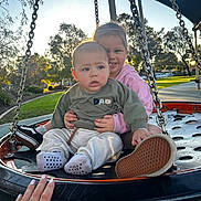 Canelo is registered to the contest to win money with this photo: child, children, swing, playground, park, outdoor, smile, happy, baby, toddler, clothing, sunlight, trees, hand, footwear, casual, daylight, nature, friends, fun