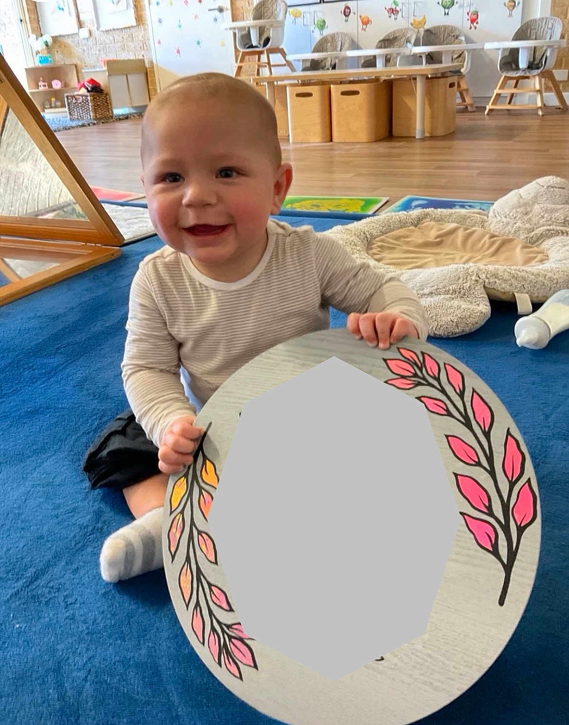 Canelo joined the competition — help win amazing prizes! baby, child, smiling, indoor, playroom, blue_carpet, toy, decorative_board, furniture, wooden_floor, high_chair, baby_bottle, soft_toy, happy, sitting, cute, person, infant, colorful, playtime