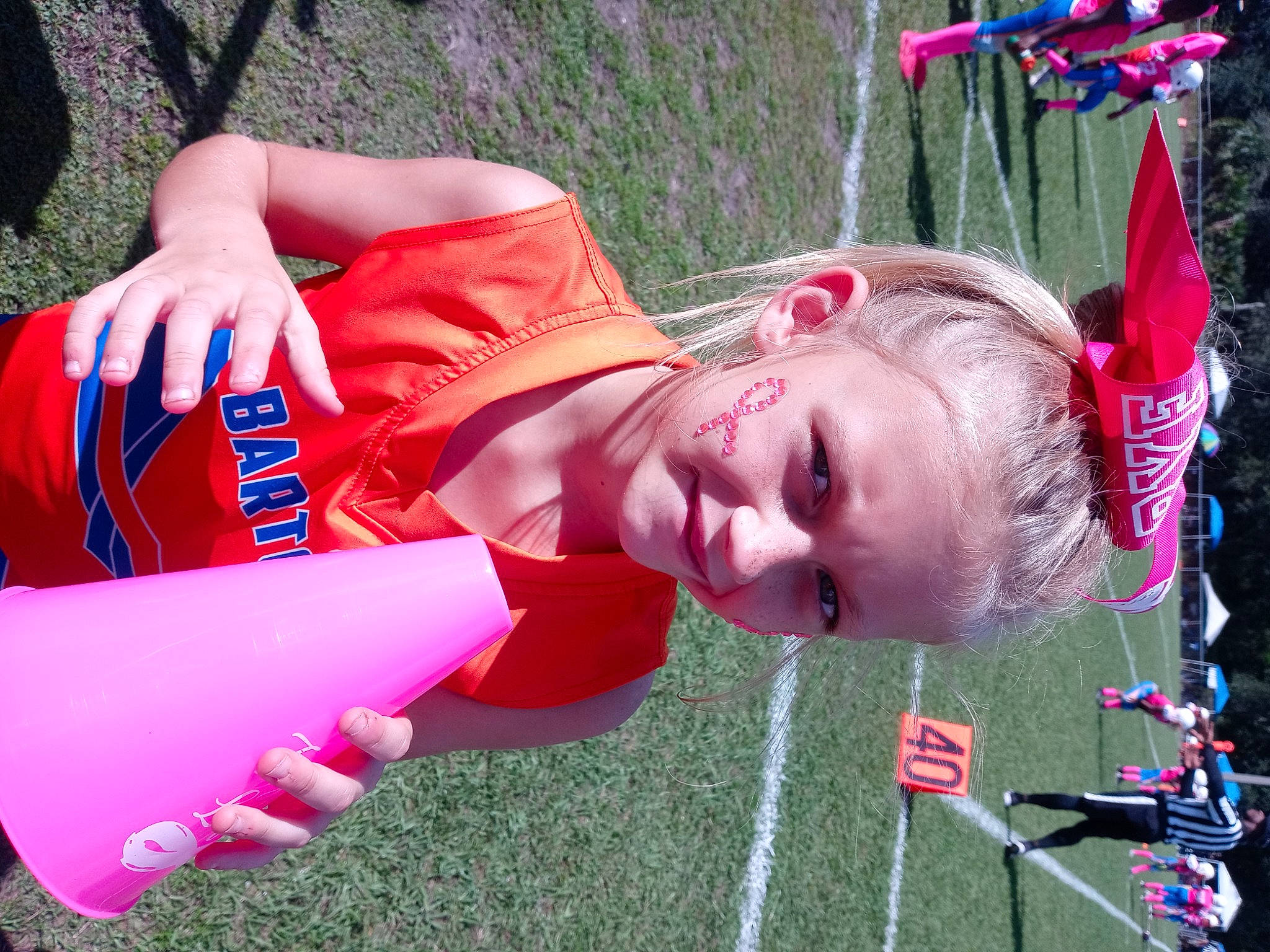 Mollie is registered to the contest to win money with this photo: baby, carmine, child, fun, grass, happy, joy, leisure, magenta, outdoor_play_equipment, person, pink, plant, play, recreation, red, toddler, tree, water