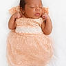 Aaliyah participe au concours pour gagner de l'argent avec cette photo : adorable, baby, blanket, closed_eyes, cute, dress, feet, foot, hands, head, infant, lace, lying_down, newborn, peaceful, peach_dress, portrait, skin, sleeping, studio
