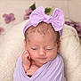 Quinn joined the competition — help win amazing prizes! newborn, baby, infant, wrapped, blanket, purple, headband, bow, flower, cushion, soft, sleepy, peaceful, closeup, portrait, indoors, cute, resting, child, toddler