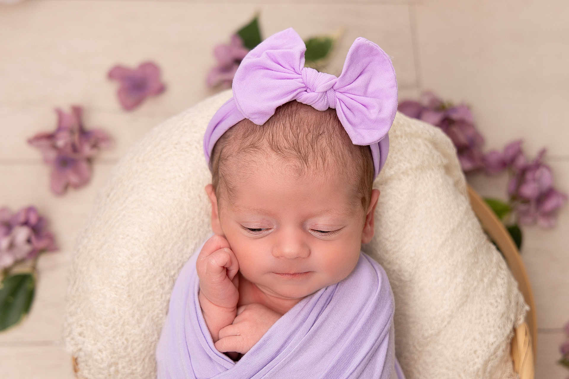 Quinn joined the competition — help win amazing prizes! newborn, baby, infant, wrapped, blanket, purple, headband, bow, flower, cushion, soft, sleepy, peaceful, closeup, portrait, indoors, cute, resting, child, toddler