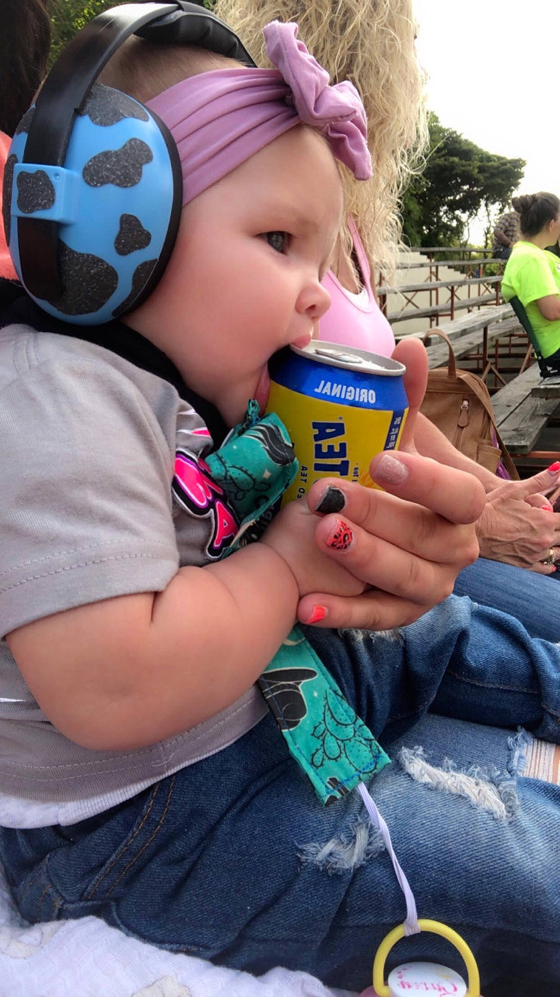Kynlee is registered to the contest to win money with this photo: baby, baby_toddler_clothing, cap, child, cool, drink, fashion_accessory, fun, grass, green, hand, happy, helmet, lip, nail, person, personal_protective_equipment, skin, sky, t_shirt