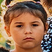 Louna a rejoint le concours — aidez-le/la à gagner de superbes lots ! child, girl, face, pigtails, hair_ties, outdoor, portrait, serious_expression, young, person, natural_light, casual_clothing, childhood, cute, headshot, summer, daylight, emotion, closeup, youth