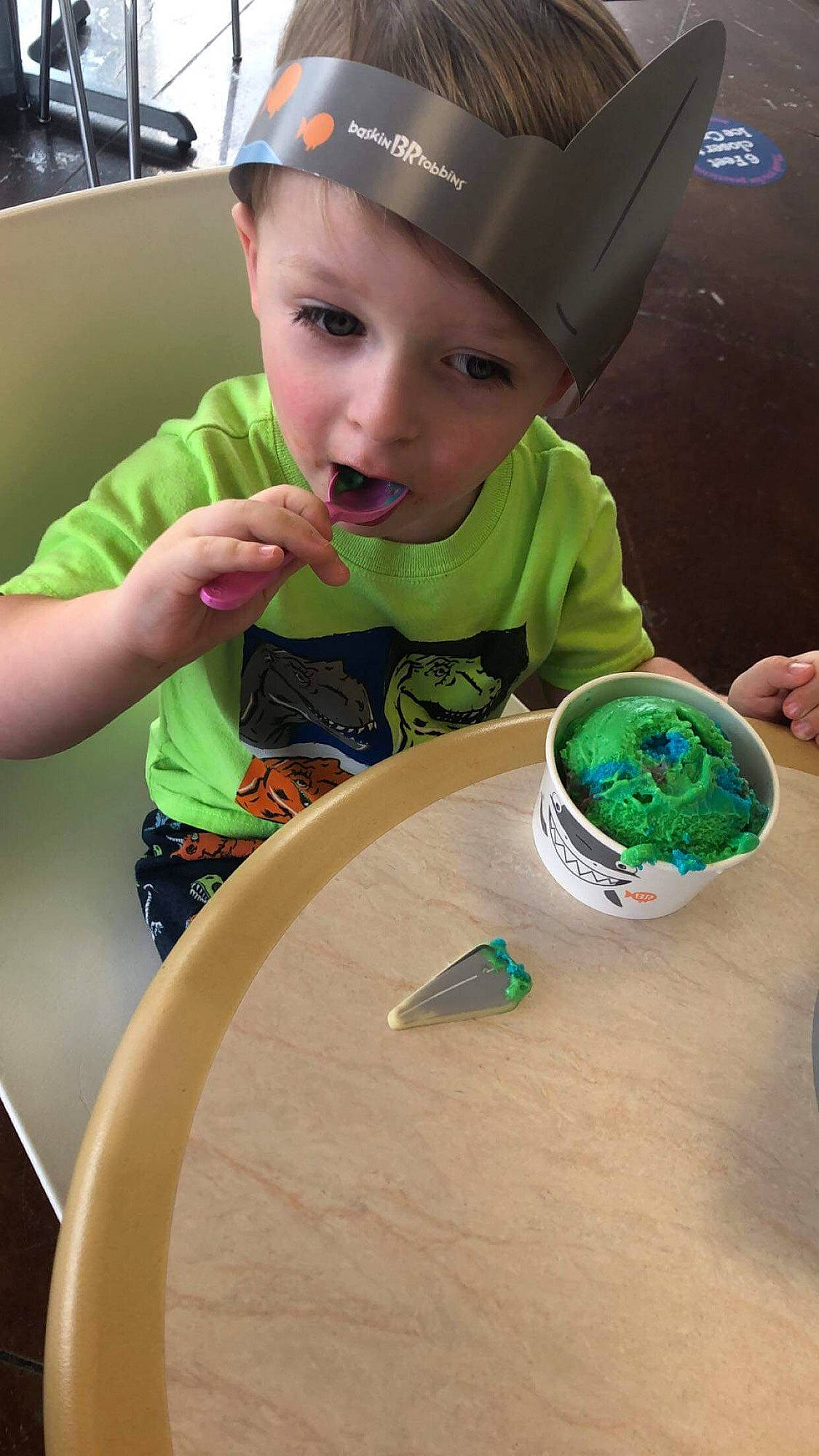 William is registered to the contest to win money with this photo: baseball_cap, cap, child, circle, cooking, fashion_accessory, fun, green, hat, headwear, person, plate, play, product, recreation, room, t_shirt, table, tableware, toddler
