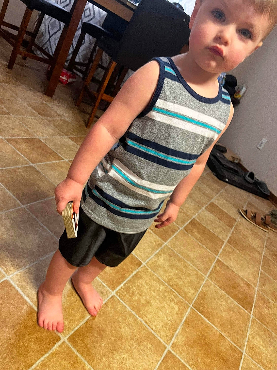 Benton is registered to the contest to win money with this photo: baby_toddler_clothing, eye, face, floor, flooring, head, joint, knee, leg, neck, person, shoe, shoulder, skin, sleeve, standing, t_shirt, thigh, toddler, waist