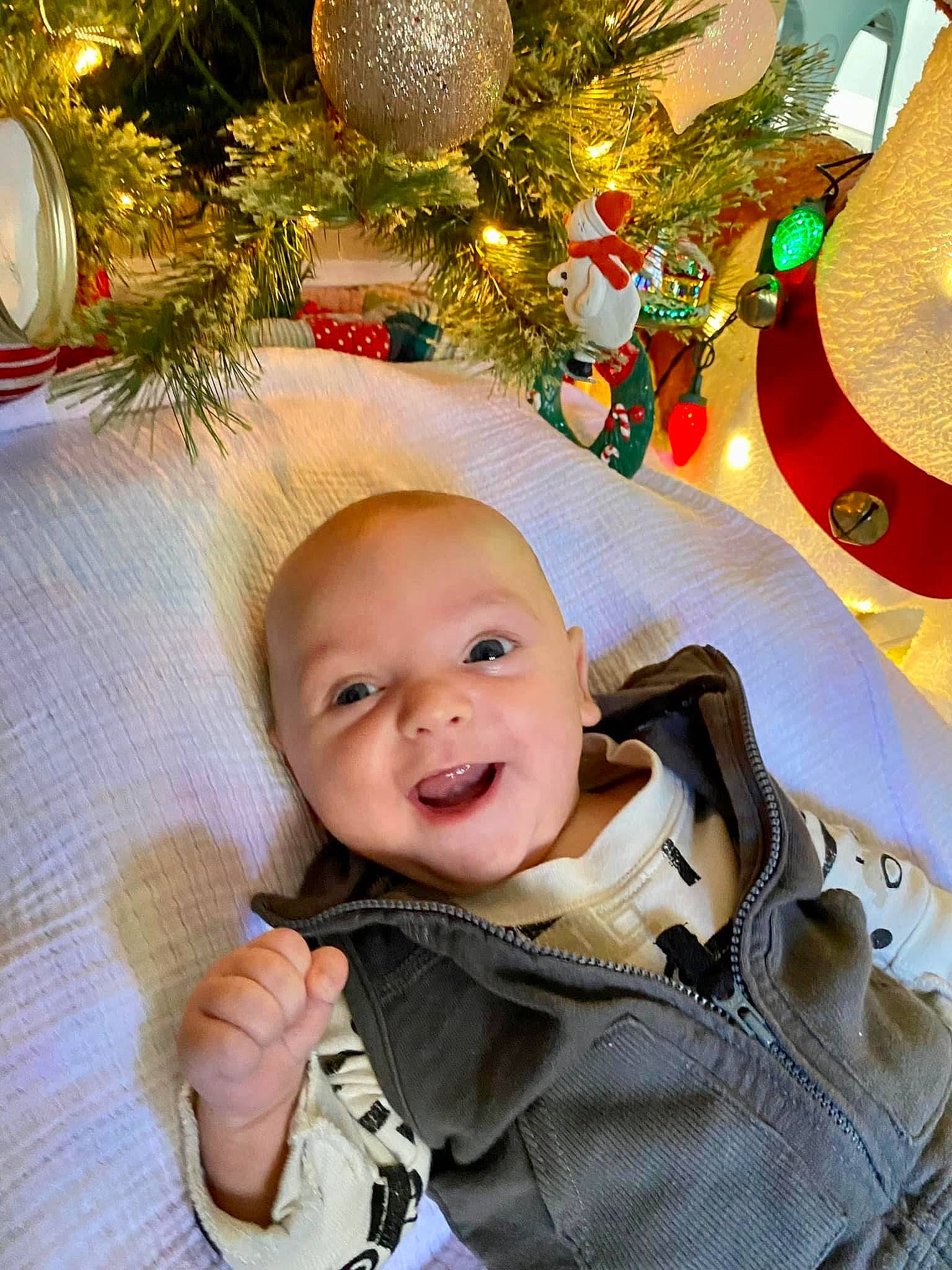 Asher joined the competition — help win amazing prizes! baby, baby_toddler_clothing, beauty, cheek, christmas, christmas_decoration, christmas_eve, christmas_ornament, christmas_tree, event, facial_expression, happy, holiday, holiday_ornament, ornament, person, smile, snapshot, toddler, tree