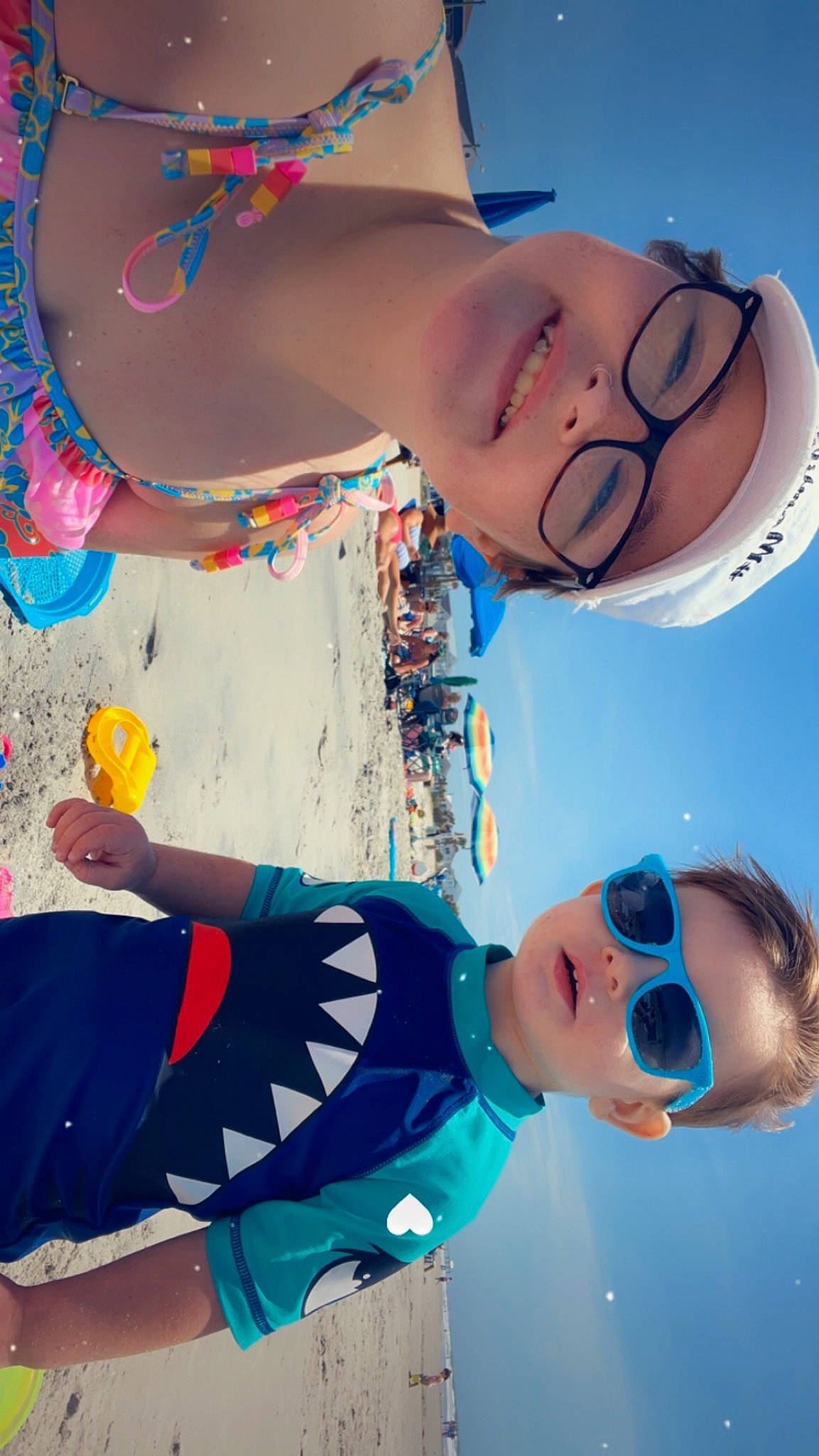 Jaxon is registered to the contest to win money with this photo: aqua, azure, beach, blue, child, cool, fun, happy, headgear, headwear, joy, leisure, light, people_on_beach, person, photograph, recreation, red, summer, toddler