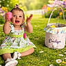 baby, child, girl, smiling, clapping, dress, bow, grass, flowers, garden, sunlight, basket, outdoor, happy, sitting, playful, nature, colorful, cute, portrait
