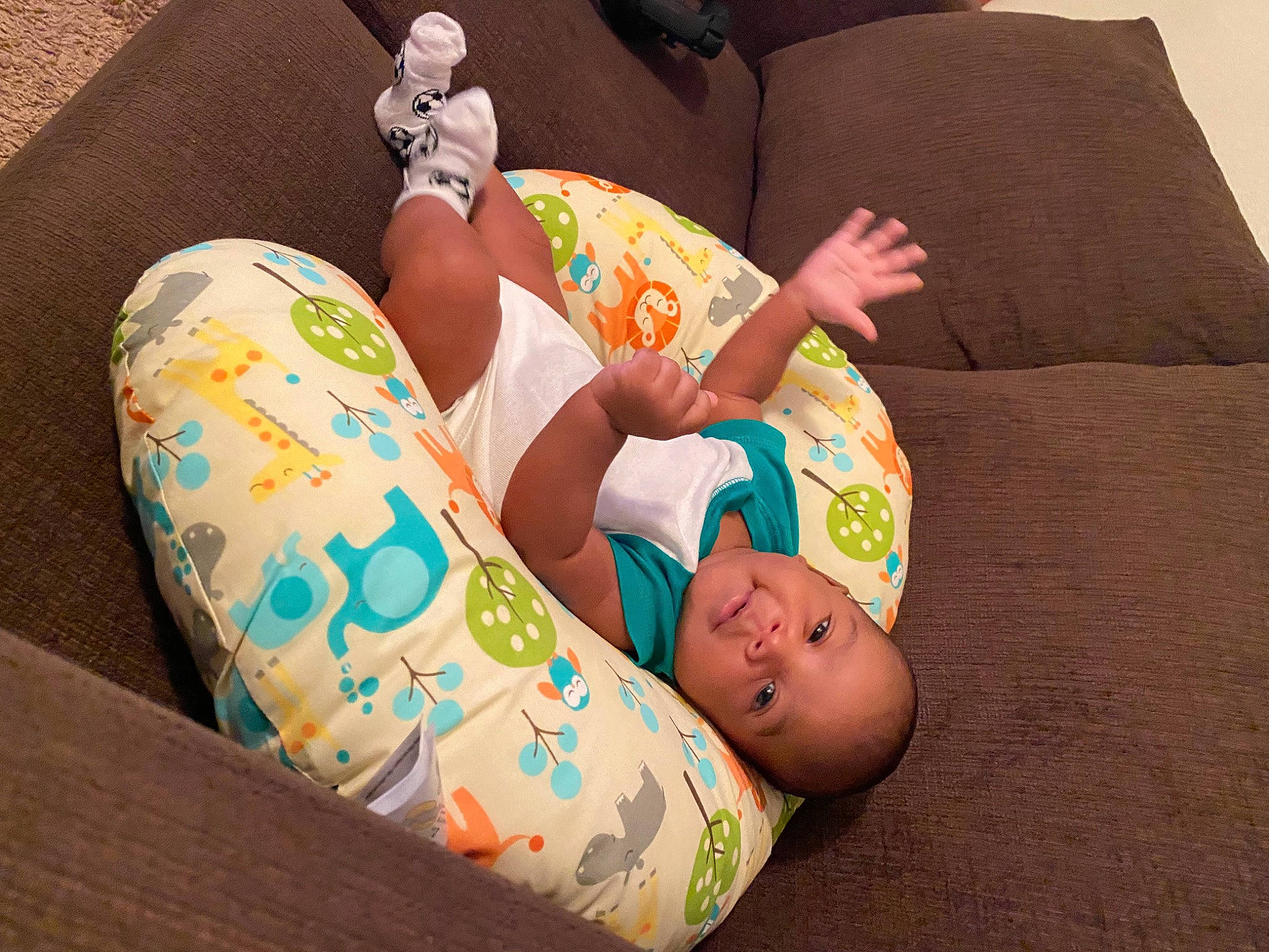 Jonah is registered to the contest to win money with this photo: baby, baby_toddler_clothing, child, comfort, couch, finger, foot, human_body, human_leg, knee, lap, leg, linens, nail, person, room, sitting, sock, thigh, toddler