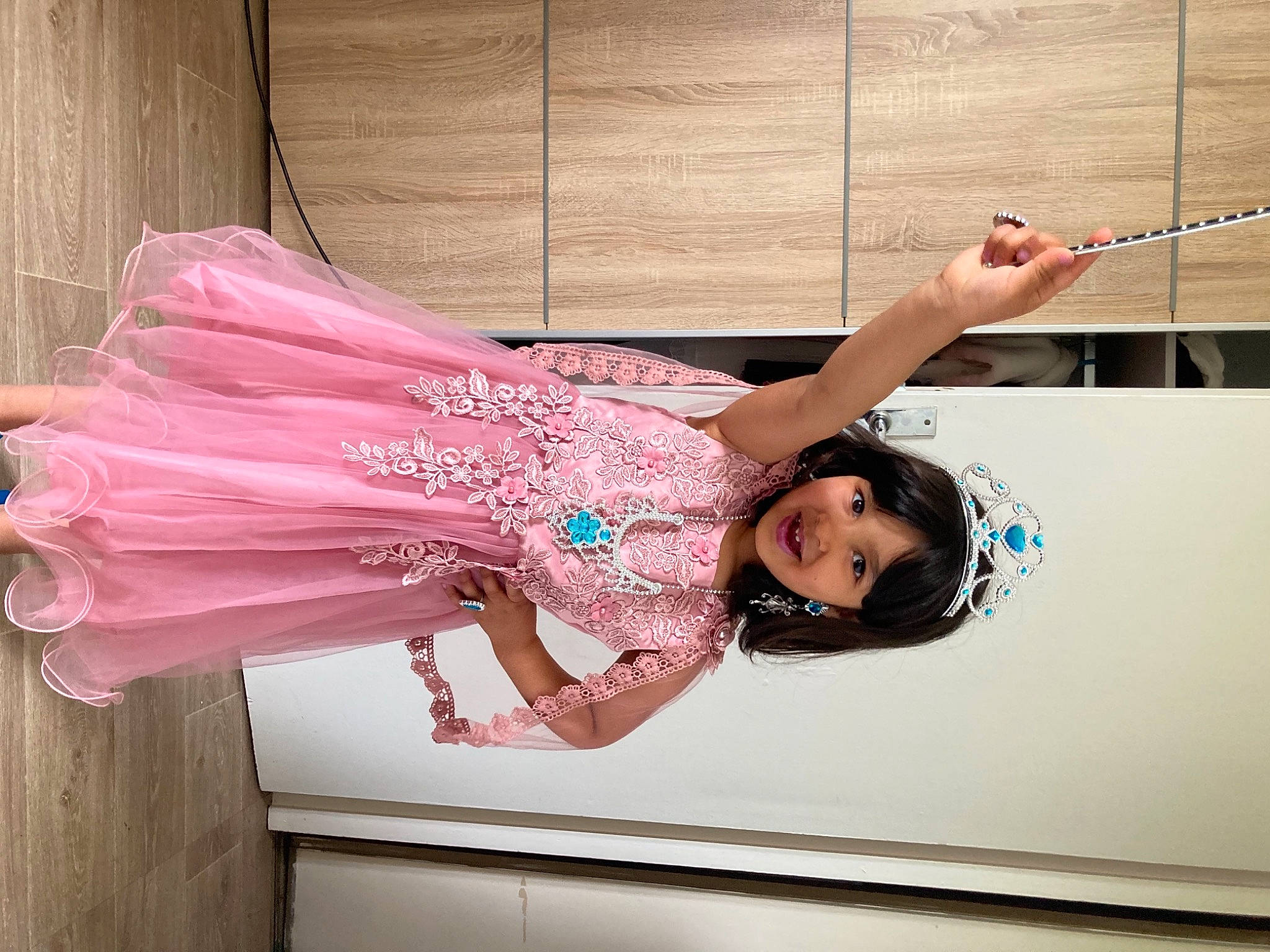 Miasina participe au concours pour gagner de l'argent avec cette photo : child, dress, event, fashion_accessory, fashion_design, fun, happy, human_body, joy, leg, leisure, magenta, pattern, peach, person, pink, room, smile, thigh, toddler