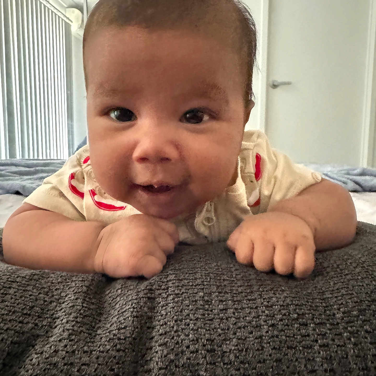 Ruhan Aditiyaa is registered to the contest to win money with this photo: baby, bed, blanket, child, close_up, cute, door, face, furniture, grooming, hands, indoors, infant, lying_down, mirror, onesie, portrait, smile, texture, window_blinds