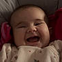 baby, smile, infant, clothing, onesie, cushion, happy, face, child, cute, portrait, indoors, cozy, soft, seat, young, cheerful, expression, closeup, person