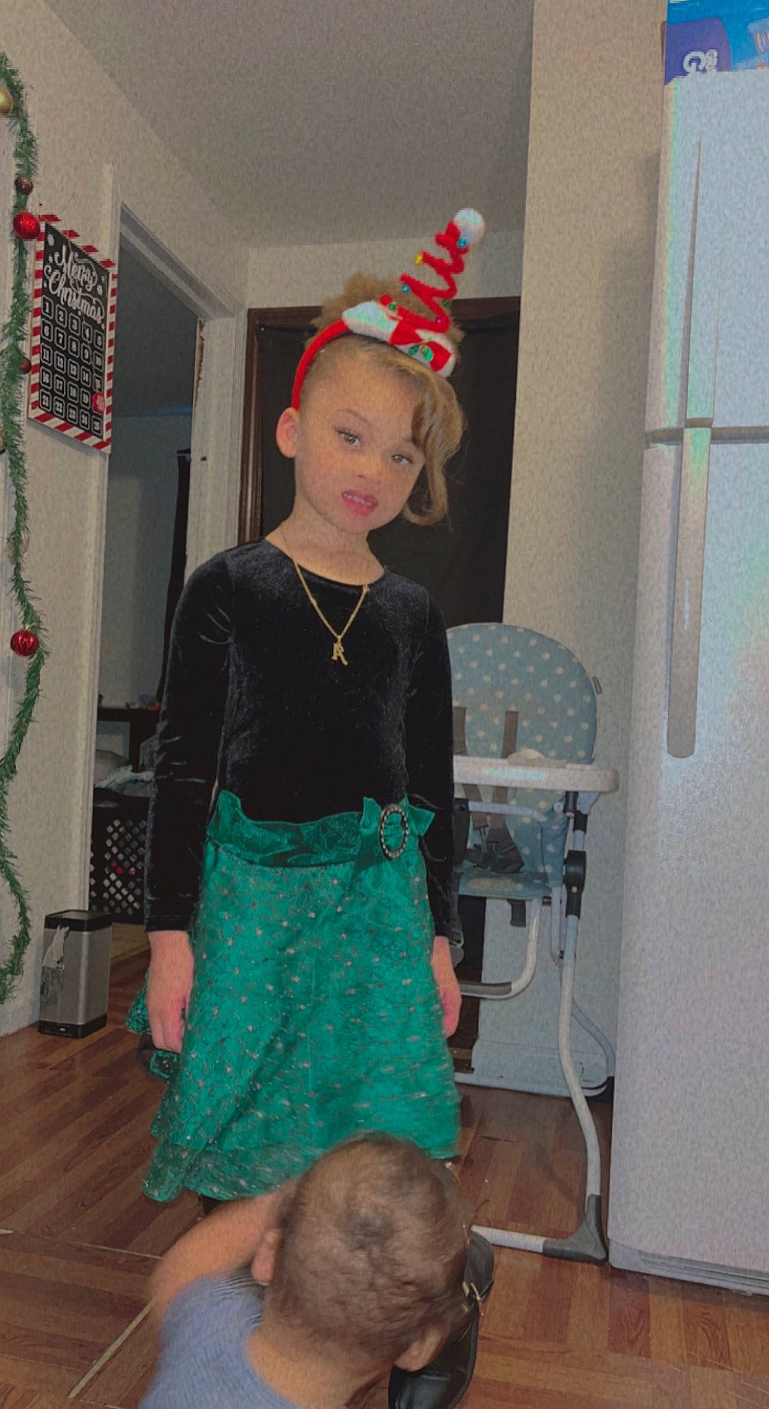 Avianna is registered to the contest to win money with this photo: child, costume, costume_hat, curtain, event, fashion_accessory, fashion_design, flooring, formal_wear, fun, hat, holiday, jewellery, magenta, person, room, standing, t_shirt, toddler, trunk