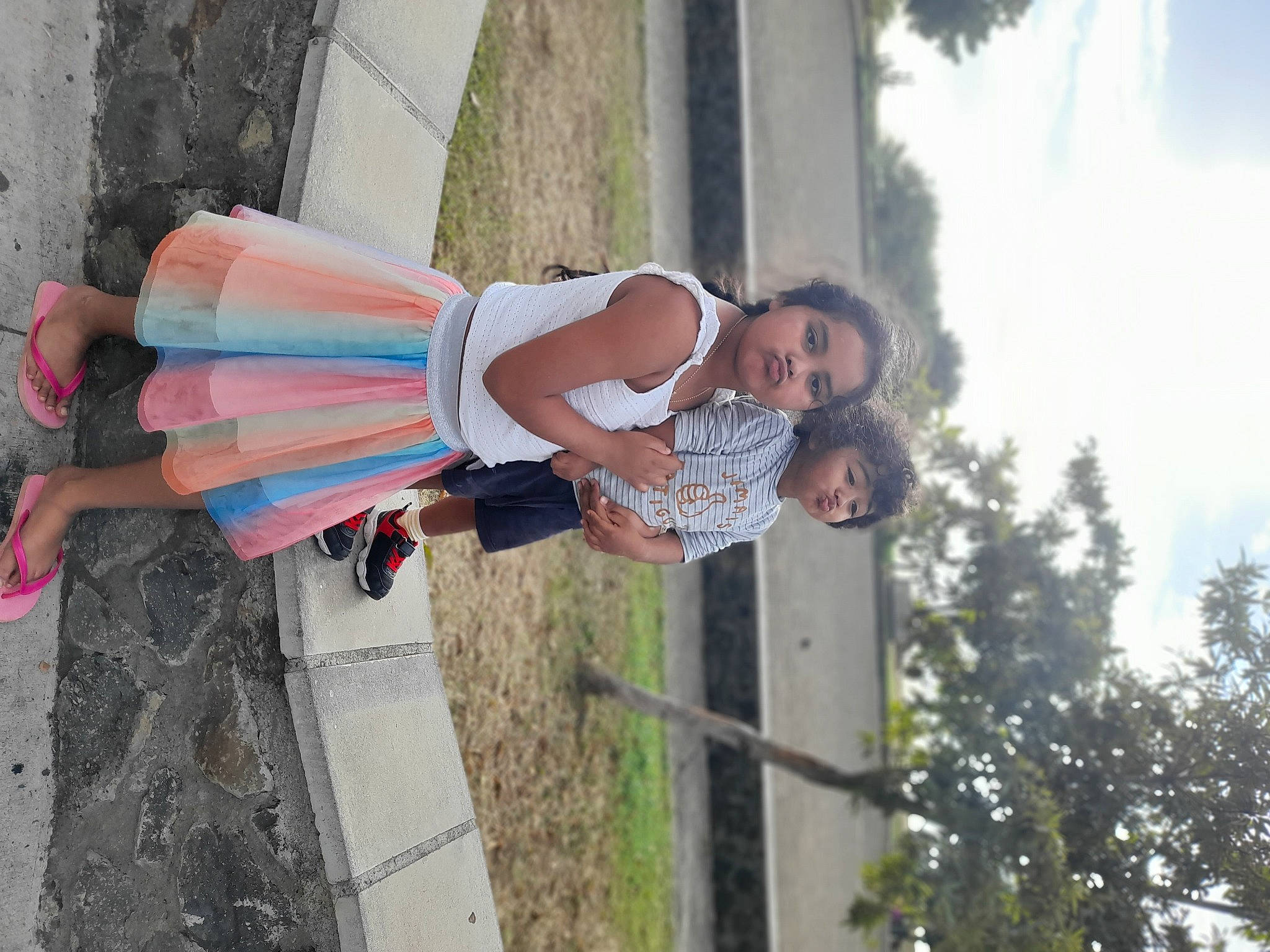 Clélya a rejoint le concours — aidez-le/la à gagner de superbes lots ! child, dress, event, eyewear, fun, happy, human_leg, leisure, person, recreation, road, sandal, sky, smile, street_fashion, thigh, toddler, tree, vacation