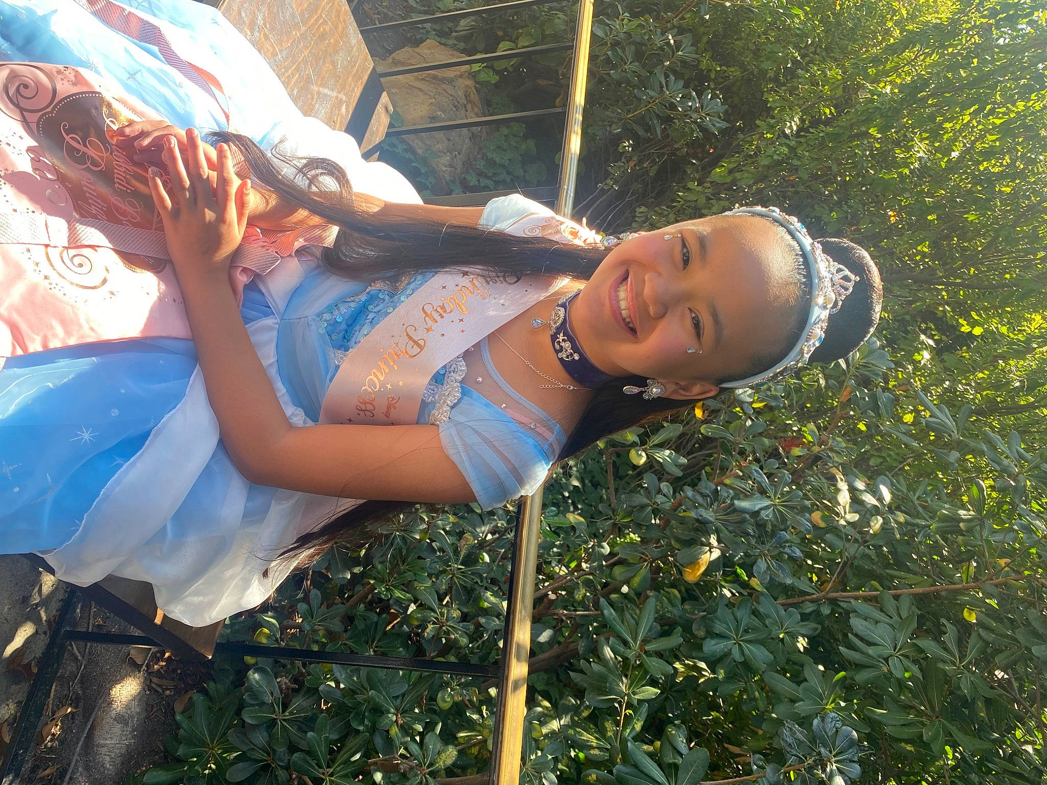 Reece is registered to the contest to win money with this photo: abdomen, beauty, denim, electric_blue, eyewear, fun, grass, happy, hat, human_leg, joy, leisure, people_in_nature, person, plant, smile, summer, sunlight, thigh, tree