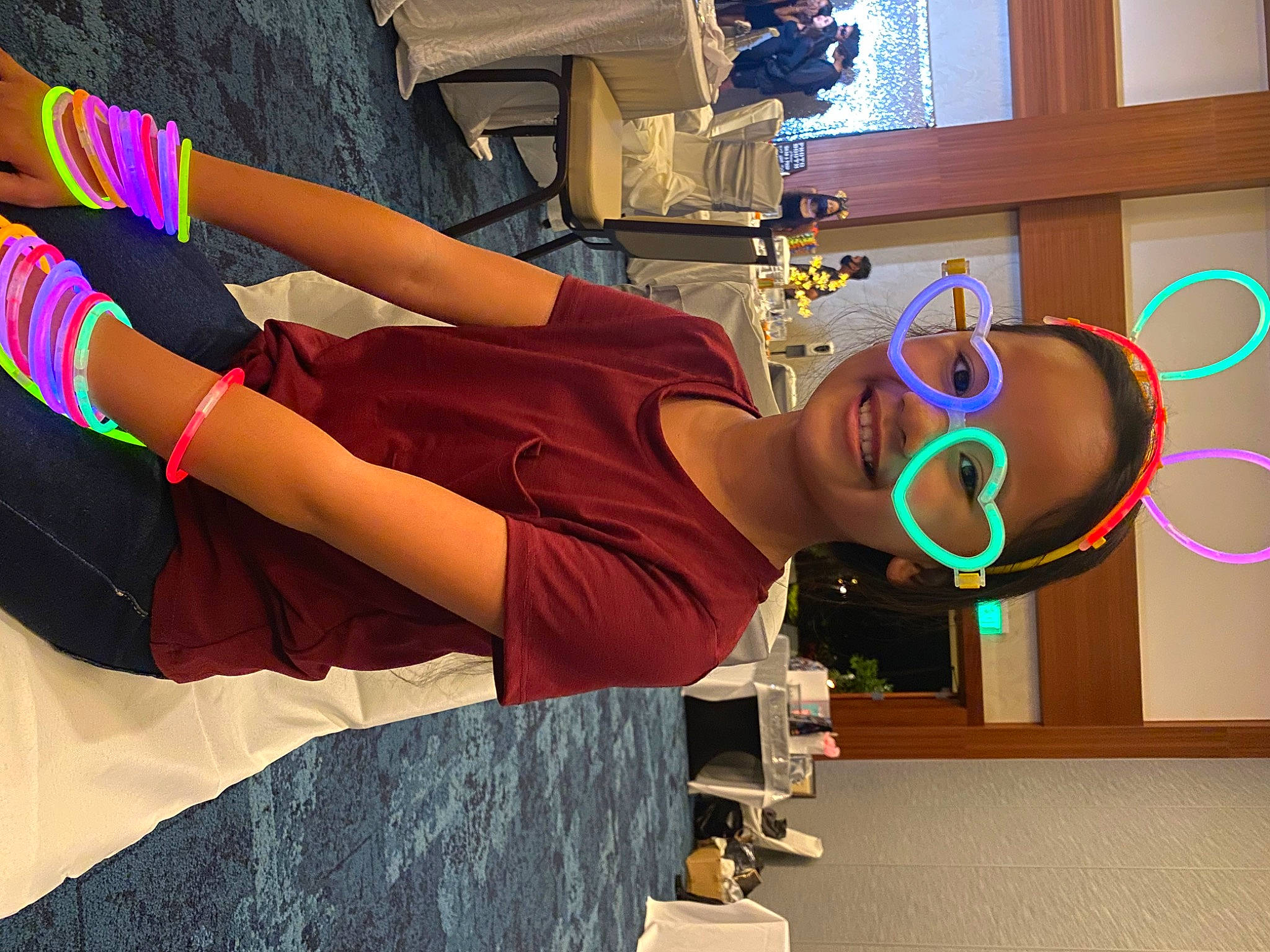 Reece is registered to the contest to win money with this photo: animation, elbow, electric_blue, eyewear, fun, happy, human_leg, joy, leisure, magenta, person, room, sitting, t_shirt, thigh