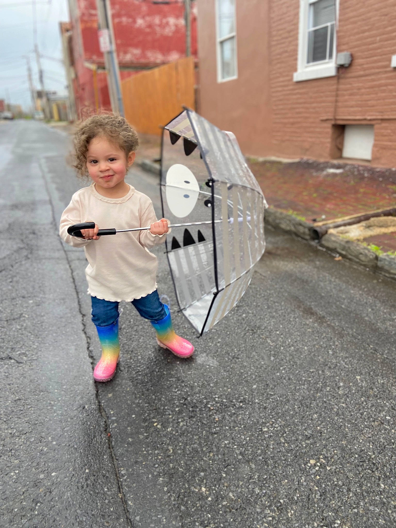 Adalyn is registered to the contest to win money with this photo: art, asphalt, building, city, concrete, fun, joy, leisure, pedestrian, person, recreation, road, road_surface, sidewalk, street, t_shirt, tar, toddler, traffic_sign, walking
